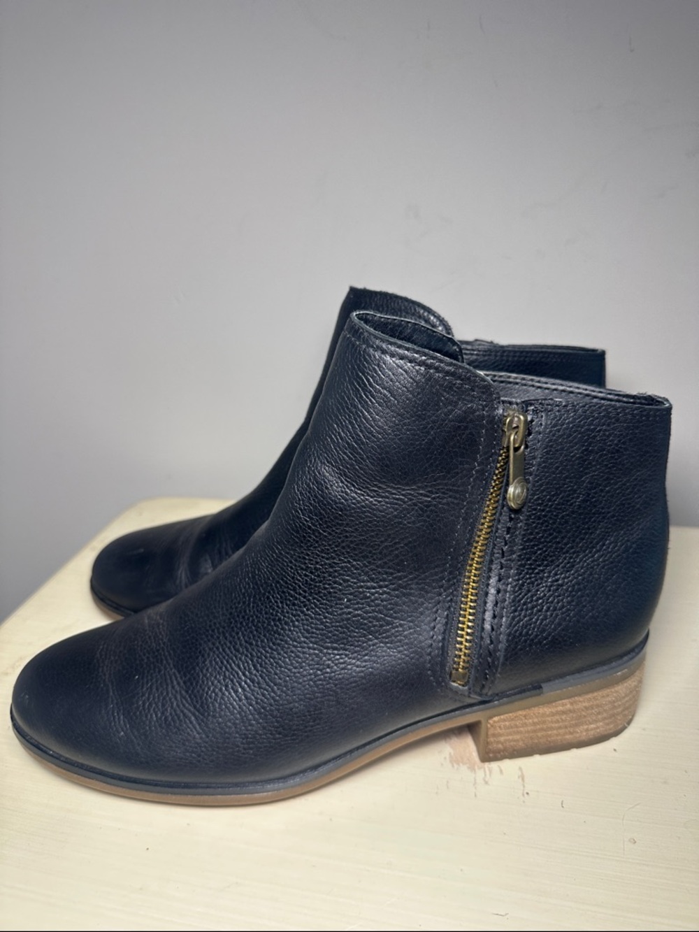 Sperry Black leather with gold double zipper ankle booties